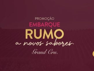 Anúncio da Grand Cru com a imagem de um vinhedo e o texto "Embarque rumo a novos sabores. São 5 ganhadores com acompanhante! Compre R$500 em produtos e concorra a uma viagem exclusiva para Portugal."