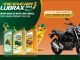 Anúncio da promoção Acelera Lubrax 2024, com uma moto Yamaha Fazer F250 ABS preta, garrafas de lubrificante Lubrax e um lagarto sorridente. O texto informa que comprando o lubrificante, você concorre a 3 motos Yamaha e ganha números da sorte para prêmios diários.