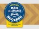 Banner promocional da Hellmann's com um fundo amarelo e branco em chevron. O logotipo da Hellmann's em azul no centro e o texto "PROMOÇÃO MAIS HELLMANN'S MAIS SUCESSO" em branco e amarelo. A frase "Pra transformar o seu restaurante!" em destaque na parte inferior, junto com os logotipos da Unilever Food Solutions e da Hellmann's, com o ano de estabelecimento 1913.