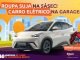 Um carro elétrico BYD branco estacionado em frente a uma pilha de roupas sujas. O logo da 5àsec e a frase "Roupa suja na 5àsec! Carro elétrico na garagem!" estão ao lado.