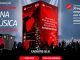 Uma imagem promocional do Santander anuncia 30 experiências completas para shows de artistas internacionais, com tudo pago e acompanhante. Um palco iluminado com um artista se apresentando para uma multidão animada, com o logo do Santander em destaque. Botões de "Cadastre-se já" para pessoas físicas e empresas.