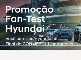 Imagem promocional da Hyundai com um carro Creta azul em destaque e a chamada "Promoção Fan-Test Hyundai". O texto descreve como participar da promoção, que inclui fazer um test drive e se cadastrar no site, para concorrer a prêmios como um vale-brinde, carros Hyundai 0km e uma viagem para a final da Libertadores.