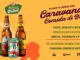 Banner promocional da Heishop para a Caravana Comida di Buteco com fundo amarelo e formas abstratas. Estão em destaque uma garrafa de cerveja Amstel, uma lata de refrigerante FYS e uma garrafa de cerveja Eisenbahn Pilsen. O texto anuncia a promoção para concorrer a cinco pacotes para o evento.