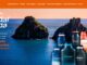 Banner promocional da Natura Kaiak intitulado Vai dar onda. A imagem apresenta frascos de perfumes da linha Kaiak em primeiro plano, posicionados à direita. Ao fundo, destaca-se uma paisagem paradisíaca de Fernando de Noronha com formações rochosas no mar e um céu em tons de pôr do sol. O texto à esquerda detalha a promoção.