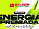 Banner promocional do Big Bom Supermercados para a campanha Energia Premiada, destacando o sorteio de uma moto elétrica sobre um fundo verde vibrante com a ilustração de um raio.