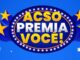 Logotipo da promoção ACSO PREMIA VOCÊ! com letras coloridas dentro de uma moldura oval iluminada sobre um fundo azul com estrelas.