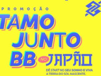 Banner publicitário com fundo amarelo e texto colorido anunciando a Promoção Tamo Junto BB no Japão, contendo o logotipo do Banco do Brasil no canto superior direito.