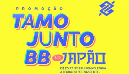 Banner publicitário com fundo amarelo e texto colorido anunciando a Promoção Tamo Junto BB no Japão, contendo o logotipo do Banco do Brasil no canto superior direito.