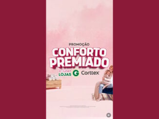 Banner promocional da campanha Conforto Premiado das Lojas G e Corttex, apresentando uma mulher abraçando uma criança em um ambiente acolhedor com tons de rosa.
