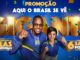 Imagem promocional com um homem e uma mulher sorridentes à frente da palavra GIGANTE em letras douradas. O fundo azul possui confetes nas cores verde e amarela e informações sobre o sorteio de salas completas.