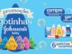 Peça publicitária da promoção Gotinhas Johnson's Baby apresentando diversos produtos da marca e pelúcias colecionáveis em formato de gotas coloridas sobre um fundo azul com bolhas de sabão.