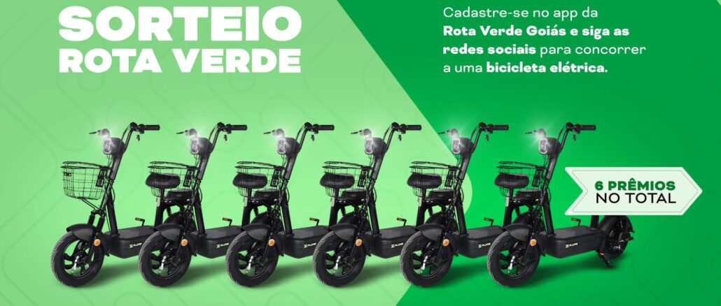 Anúncio publicitário do sorteio Rota Verde com seis bicicletas elétricas pretas alinhadas sobre um fundo verde vibrante com grafismos ondulados e textos explicativos sobre a promoção.
