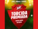 Imagem promocional da campanha Torcida Premiada do São Judas Tadeu Supermercados. No centro, um grande escudo vermelho exibe o nome da promoção e a frase Juntos Rumo ao Hexa, posicionado sobre um fundo verde com luzes de refletores de estádio.