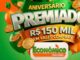 Arte promocional da campanha Aniversário Premiado do Econômico Atacadão, com destaque para o prêmio de R$150.000,00 em vales-compras, sobre fundo verde e laranja com balões e moedas douradas.