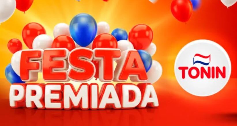 Banner publicitário da Festa Premiada Tonin com balões coloridos e letras em 3D sobre um fundo laranja vibrante.