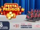Banner promocional da Festa de Prêmios com fundo de cortinas azuis e diversas motocicletas vermelhas alinhadas. O anúncio destaca que a cada R$50 em compras o cliente recebe 1 cupom e ganha 1 cupom adicional ao utilizar o cartão crediário.
