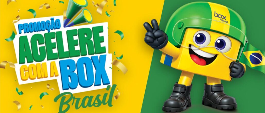 Promoção Acelere com a Box Mania Brasil Mascote da Box Mania com capacete verde e amarelo, segurando uma bandeira do Brasil, ao lado do texto "Promoção Acelere com a Box Mania Brasil" sobre fundo verde e amarelo com confetes.