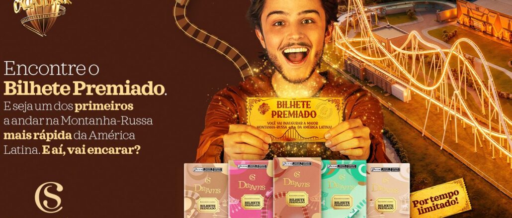 Peça publicitária da Cacau Show apresentando a promoção Bilhete Premiado, com chocolates Dreams e montanha-russa ao fundo.