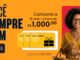 Peça publicitária da Joalheria Exótica com fundo laranja, apresentando mulher sorridente usando óculos e roupa amarela, ao lado de três vales-compra amarelos e a frase "Você Sempre Bem".