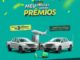 Imagem publicitária de campanha promocional com fundo verde exibindo duas caminhonetes prateadas, eletrodomésticos, eletrônicos e um avião comercial em decolagem.