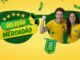 Peça publicitária da promoção Seleção Mercadão dos Óculos 2026, com cores verde e amarelo inspiradas na seleção brasileira, dois modelos comemorando vestindo camisetas do Brasil, e a frase "E ainda gire a roleta e ganhe brindes na hora".