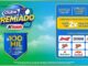 Banner promocional do Clube K Premiado da rede Koch com céu azul e gramado verde ao fundo. O anúncio destaca prêmios de R$100MIL e logotipos de marcas aceleradoras como Coca-Cola e Heineken.