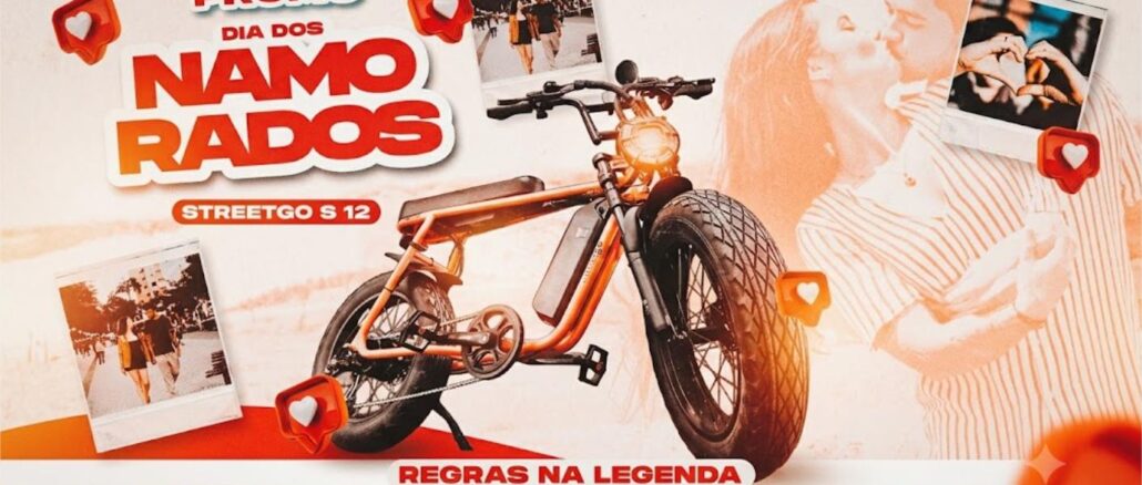 DIA DOS NAMORADOS DE BIKE ELÉTRICA JOVEM PAN BH Arte promocional da Promo Dia dos Namorados da Jovem Pan FM Belo Horizonte em parceria com a StreetGo, apresentando uma bike elétrica modelo StreetGo S12 como prêmio.