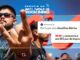 Pôster promocional digital intitulado Desafio #EUVOUnoRockinRio 2026.jpg com fundo azul texturizado, exibindo um homem de óculos escuros em primeiro plano fazendo o gesto da mão com os chifres do rock. Há caixas de texto simulando uma publicação da rede social X que dizem Participe dos desafios diários e concorra a um (01) par de ingressos!.