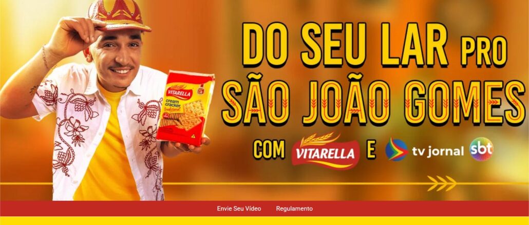 Do Seu Lar pro Sao Joao Gomes com Vitarella e TV Jornal Banner promocional da campanha Do Seu Lar pro São João Gomes, com Vitarella e TV Jornal SBT, mostrando um homem sorridente com chapéu de cangaceiro segurando um pacote de biscoito cream cracker Vitarella.