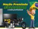 Banner da promoção Nação Premiada Soldamaq 2026, com fundo verde escuro e elementos gráficos em referência à bandeira do Brasil, exibindo os prêmios disponíveis: geladeira expositora, televisor, mochila térmica, motocicleta Honda Start, garrafa térmica, squeeze, chaveiro, isqueiro e smartphone, além de um mascote no estilo trabalhador da construção segurando uma bandeira do Brasil e fazendo o sinal de paz e amor.