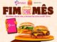 Banner promocional da parceria entre Serasa e Burger King para a campanha Fim do Mês, com fundo de calendário, ícone de smartphone exibindo o aplicativo Serasa e dois sanduíches do BK sobre bandeja laranja