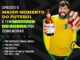 Homem sorridente com camisa amarela da seleção brasileira segurando uma garrafa de Cerveja Louvada Pilsen 355ml e uma tampa de garrafa com a hashtag #HONRE, ao lado do texto "Chegou o maior momento do futebol e tem motivos de sobra pra comemorar".