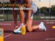 Anúncio do protetor solar Dermage Photoage Water Sport FPS 50+ com oferta de reembolso garantido, exibindo atleta amarrando o tênis em uma pista de atletismo.