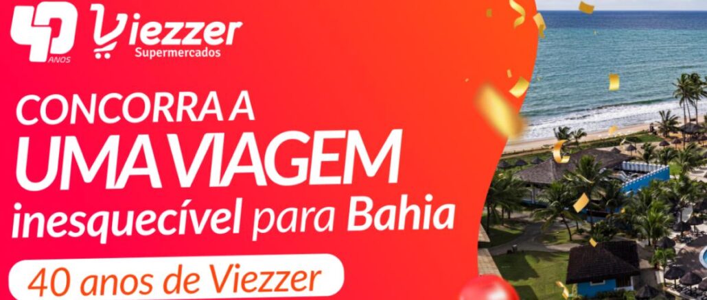 Aniversário 40 Anos Viezzer Supermercados no Rio Grande do Sul Banner vermelho da promoção de 40 anos da Viezzer Supermercados com sorteio de viagem para a Bahia, mostrando resort à beira-mar com coqueiros, confetes dourados e balão vermelho.