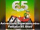 Banner da promoção Aniversário Supermercados Fonseca 65 Anos com casa de telhado vermelho, mascote apontando para selo de 2 casas e 2 ganhadores e número 65 em destaque dourado e branco.
