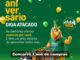 Banner do Aniversário Giga Atacado com mascote rinoceronte usando chapéu de festa e segurando balão do Clube Giga, ao lado de carrinho de compras cheio de produtos, sobre fundo verde.