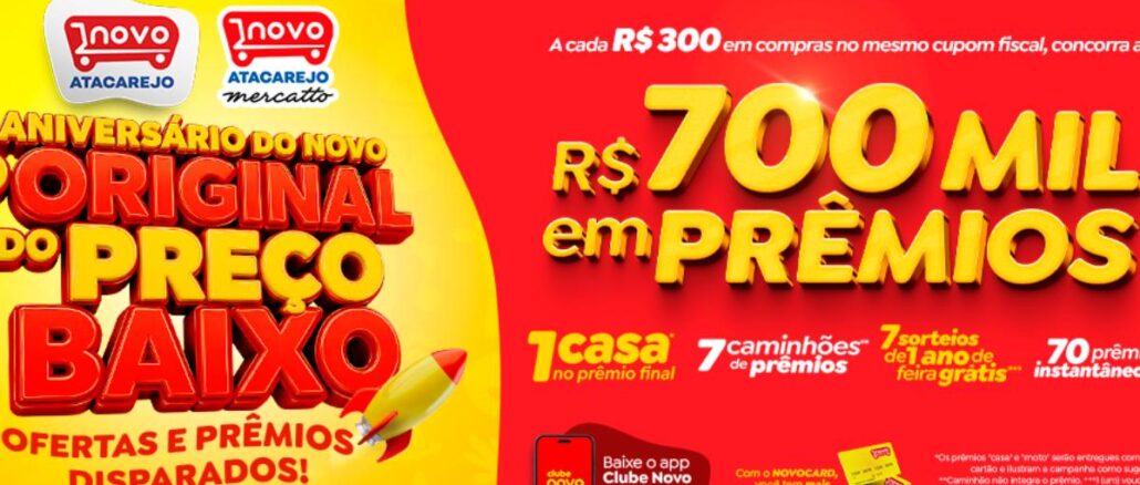 Aniversário Novo Atacarejo Banner da promoção de Aniversário do Novo Atacarejo e Novo Atacarejo Mercatto, com prêmios de R$700 mil, incluindo uma casa, caminhões de prêmios e sorteios de 1 ano de feira grátis.
