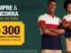 Pai e filho sorridentes, de braços cruzados, vestindo polos das cores branco, vermelho e azul-marinho, ao lado do logotipo da Avenida, com banner amarelo anunciando sorteio de R$300,00 em vale-compras.