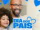 Pai sorridente usando óculos ao lado do filho pequeno, ambos sorrindo, com logo Dia dos Pais no Shopping Grande Circular em Manaus e corações azuis ao fundo