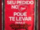 Cartaz vermelho colado em muro anuncia que pedidos feitos pelo iFood podem levar o cliente ao festival Rock in Rio 2026, com o coração do logotipo do iFood ao centro e um ingresso ilustrado ao lado direito.