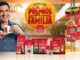 Ator sorridente segura xícara de Café Evolutto ao lado de embalagens dos produtos da marca e banner amarelo da Promoção Prêmios em Família, com destaque para prêmios de 3 carros, R$10 mil por semana e mais de 1.000 prêmios instantâneos.