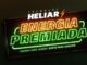 Banner da Promoção Heliar Energia Premiada com letreiro neon nas cores laranja e verde sobre fundo escuro, trazendo o slogan energia para vender, sorte para ganhar.