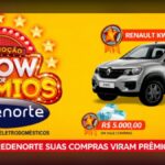 Banner amarelo da promoção Show de Prêmios Redenorte com um Renault Kwid zero quilômetro cinza ao centro, ladeado por dois selos de vale compras de R$5.000,00 cada, logotipo da Redenorte e faixa vermelha inferior com a frase Nas lojas Redenorte suas compras viram prêmios, participe.