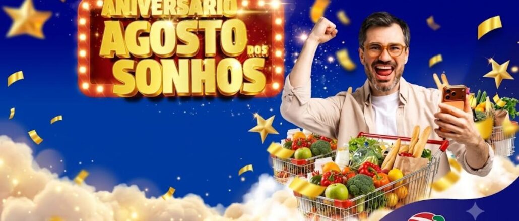 Banner da promoção Aniversário Agosto dos Sonhos do D'Avó Supermercados, com homem comemorando ao lado de carrinho cheio de frutas e legumes, sobre fundo azul estrelado com confetes dourados.
