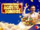 Banner da promoção Aniversário Agosto dos Sonhos do D'Avó Supermercados, com homem comemorando ao lado de carrinho cheio de frutas e legumes, sobre fundo azul estrelado com confetes dourados.