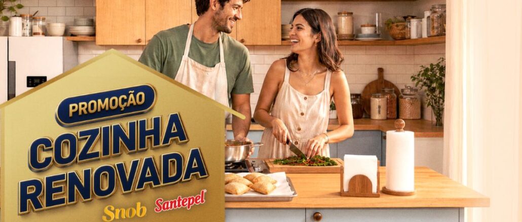 Banner da Promoção Cozinha Renovada Snob e Santepel, com casal cozinhando em uma cozinha moderna e bem decorada.