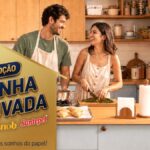 Banner da Promoção Cozinha Renovada Snob e Santepel, com casal cozinhando em uma cozinha moderna e bem decorada.