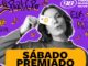 Banner da promoção Sábado Premiado da rádio 98FM de Curitiba, com jovem segurando cartão de crédito em fundo roxo vibrante.
