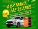 Arte da promoção de aniversário de 32 anos da BR Mania com um SUV prata e um smartphone laranja sobre fundo verde com balões.