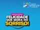 Arte do Concurso Cultural Felicidade que Mora no Sorriso, promovido pela marca Lição de Sorriso, com fundo azul e tipografia em destaque.